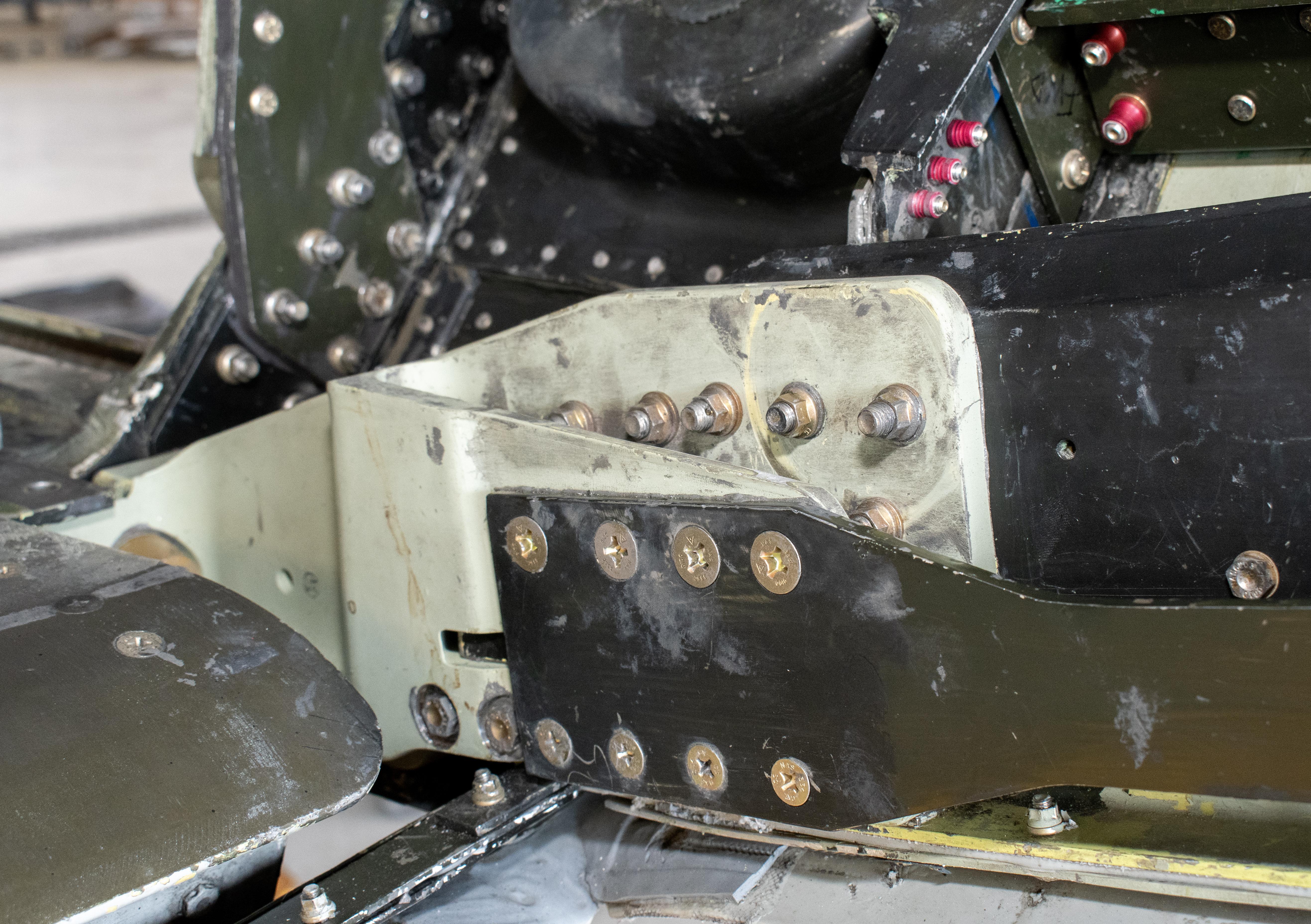 Close up image of green and tan aircraft part 