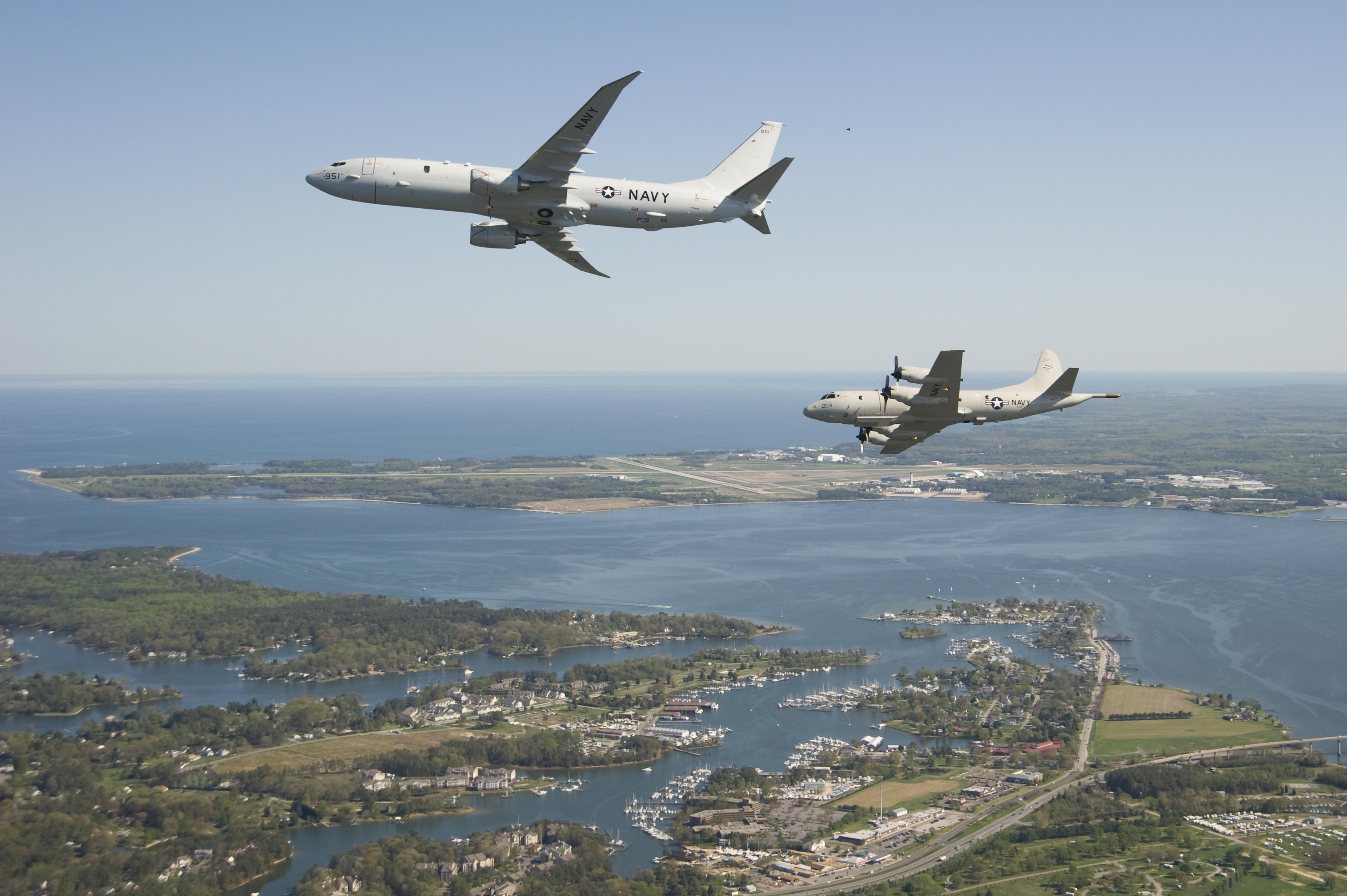 A P-8A and a P-3C Orion fly over Patuxent River, Md. 