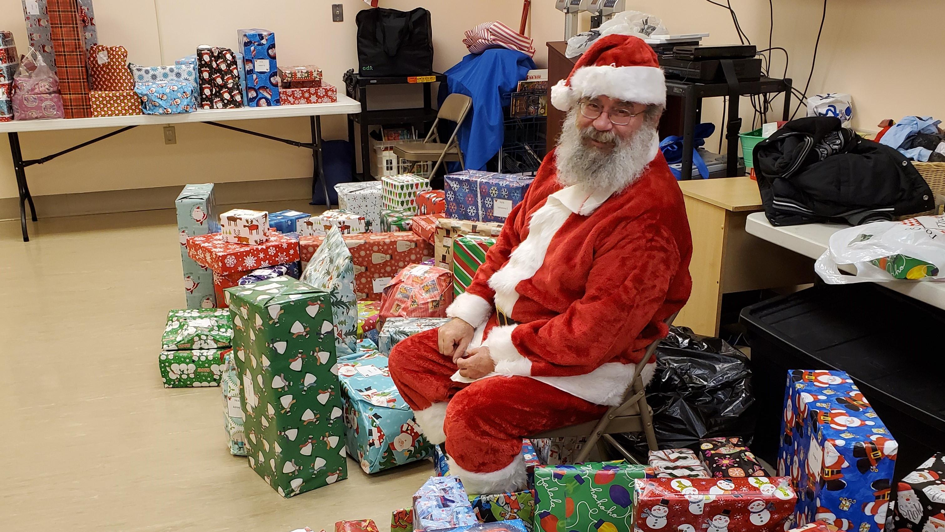 Santa with the Giving Tree gifts