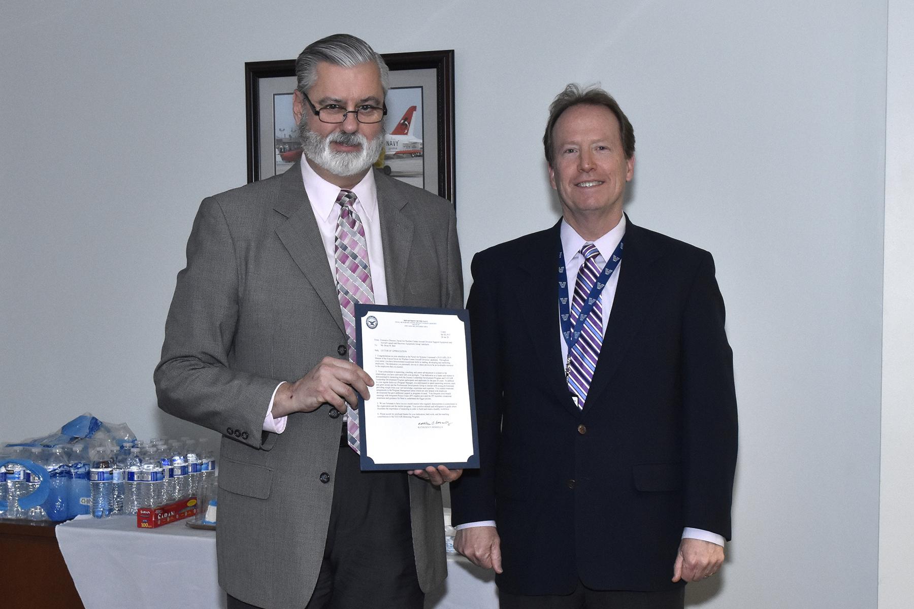 Lakehurst Mentor of the Year Brian Barr receives his certificate from Technical Director Jack Martenak