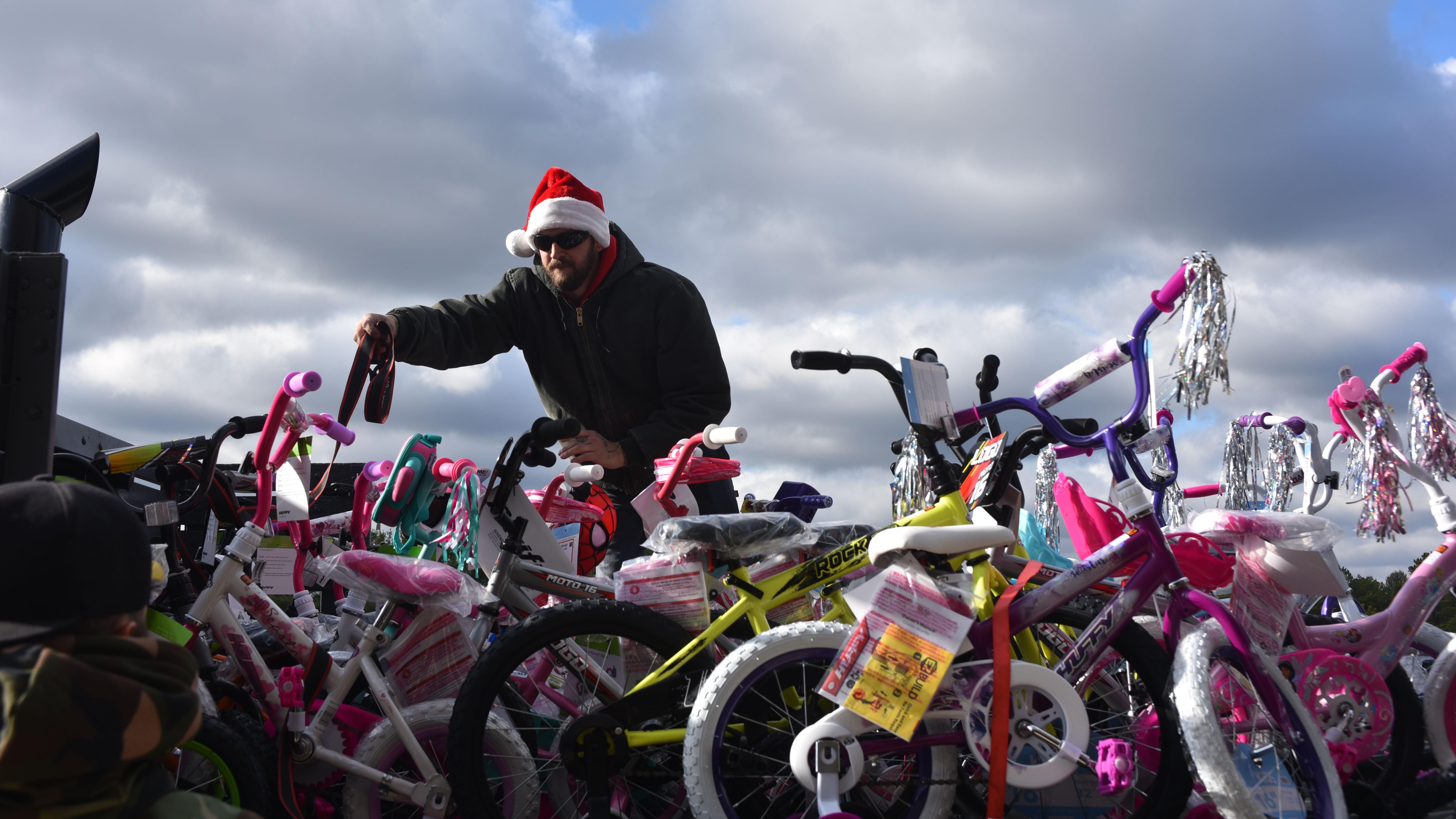 Volunteer delivers bikes for toys for tots