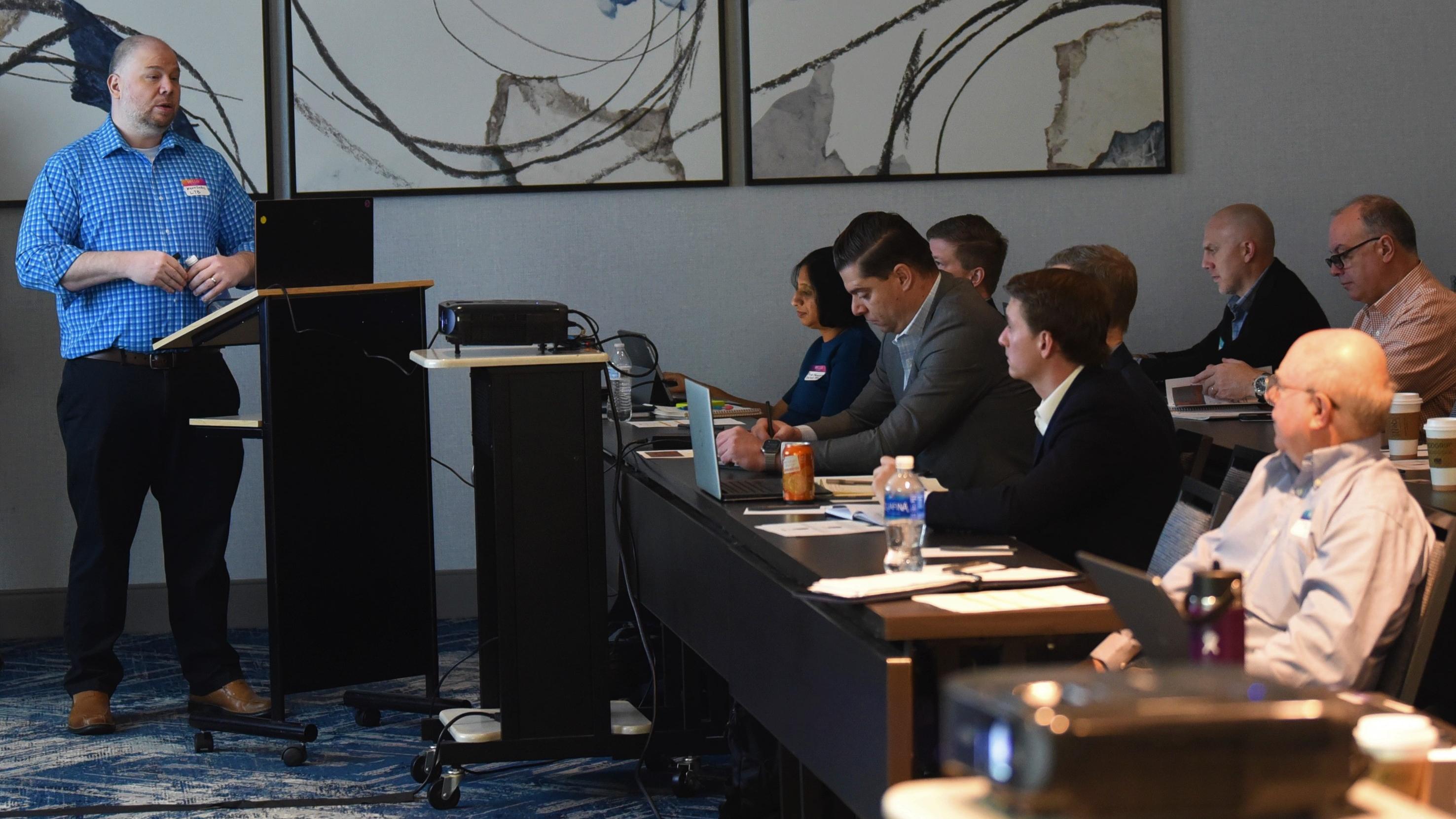 NAWCAD Lakehurst employee Kevin Larkins speaks during a meeting on shipboard robotics in Philadelphia