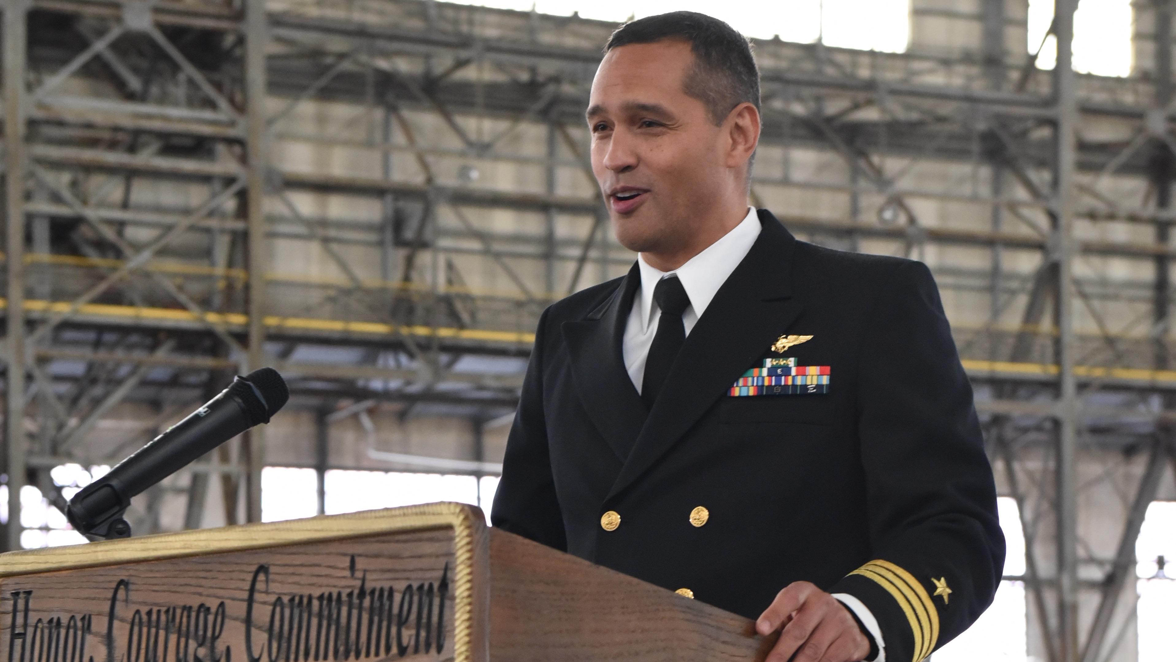CDR Reynolds speaks at podium