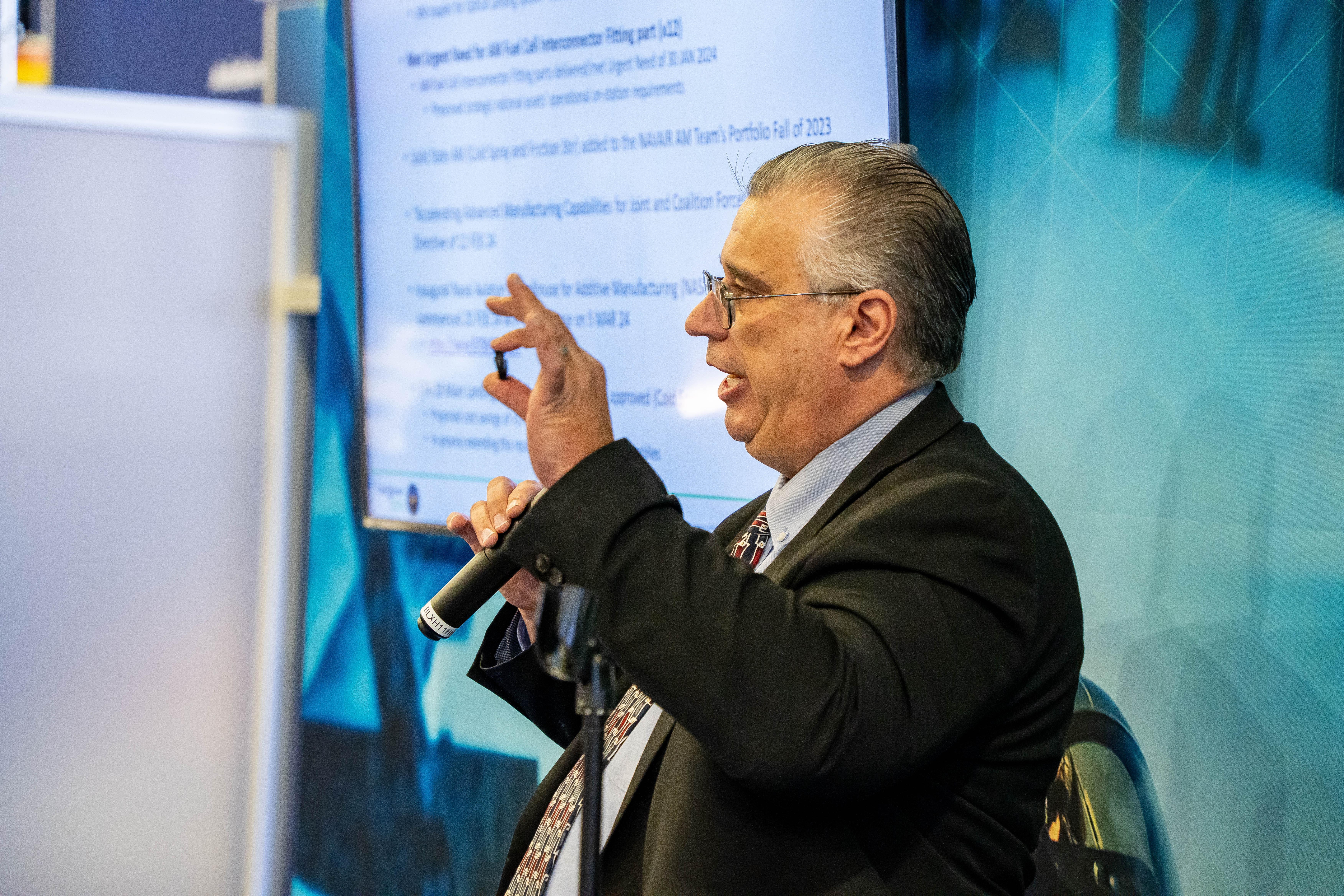 Theodore Gronda, program manager for the NAVAIR Additive Manufacturing (AM) Team, highlights ways AM has helped solve supply chain issues for the Navy at the Sea-Air-Space Expo 2024.