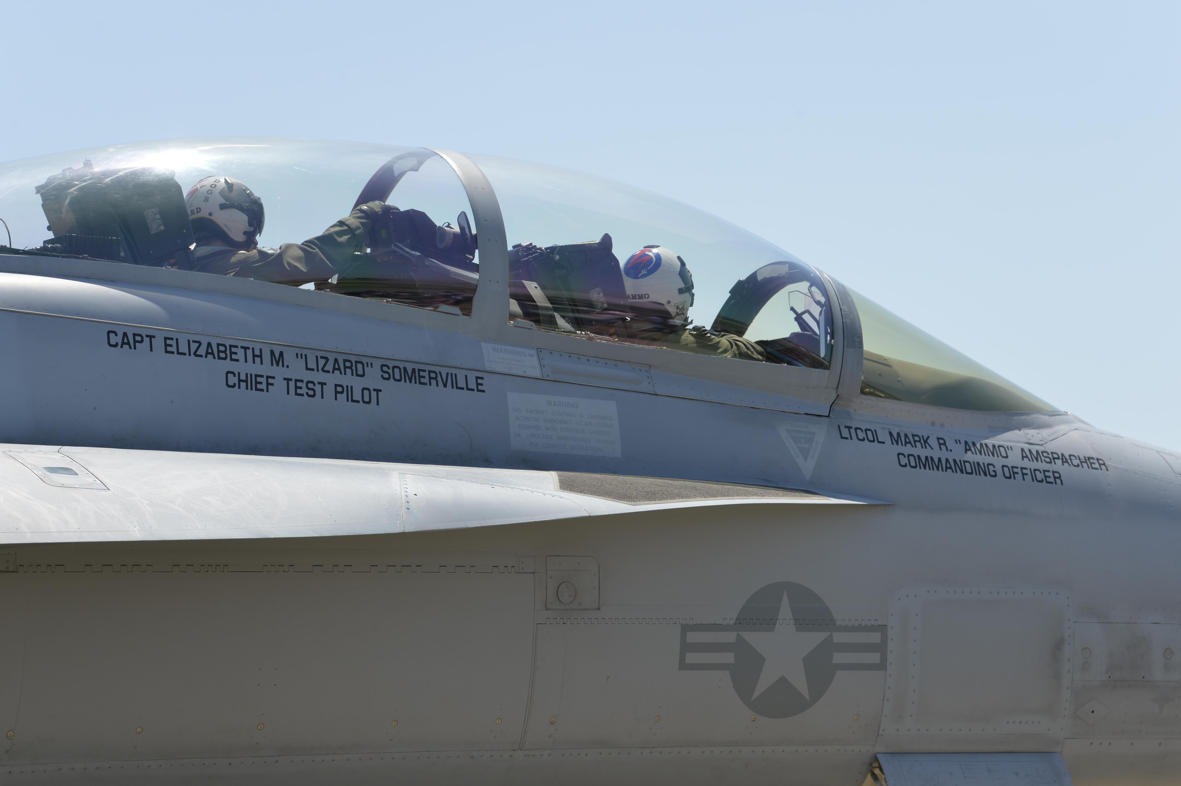 Capt. Elizabeth Somerville flies with Lt. Col. Mark Amspacher during an airborne change of command ceremony