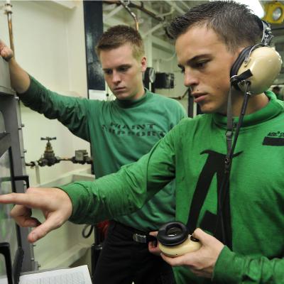 Sailors work on advanced recovery control panel aboard 