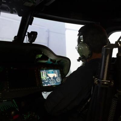 A pilot performs a simulated shipboard-landing maneuver through fog in a virtual scenario at the Naval Air Warfare Center Aircraft Division’s Manned Flight Simulator in Patuxent River, Md. 