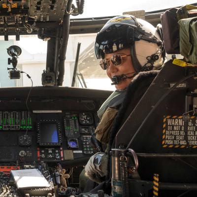 Barb Gordon seated in a UH-60L Black Hawk