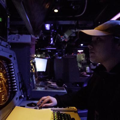 Sailor identifies air contacts from the combat information center 