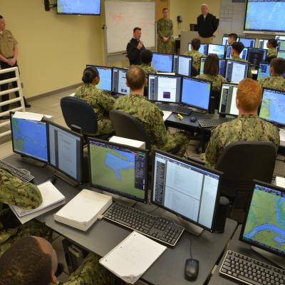 GREAT LAKES, Ill (April 26, 2019) Rear Adm. Kyle Cozad, commander of Naval Education and Training Command, visits with students at Center for Surface Combat Systems Unit Great Lakes Operations Specialist "A" School in the VMS lab, April 26, 2019.