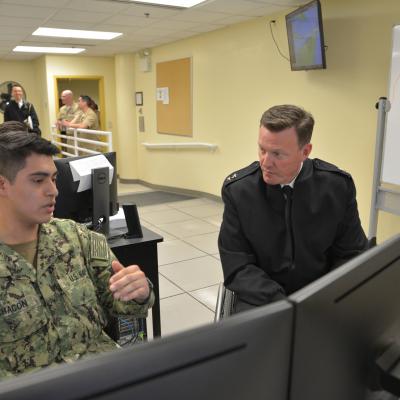 GREAT LAKES, Ill (April 26, 2019) Rear Adm. Kyle Cozad, commander of Naval Education and Training Command, visits with students at Center for Surface Combat Systems Unit Great Lakes Operations Specialist "A" School in the VMS lab, April 26, 2019. (U.S. Navy photo by Brian Walsh/Released)