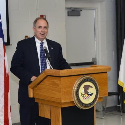 John J. Daly, President of the Central Florida Federal Executive Association and Naval Air Warfare Center Training Systems Division Director of Corporate Operations welcomes attendees to the association's first-ever Federal Employee of the Year Awards Ceremony at the Federal Correctional Complex - Coleman. The awards ceremony held during Public Service Recognition Week honored the contributions of federal employees throughout Central Florida.  