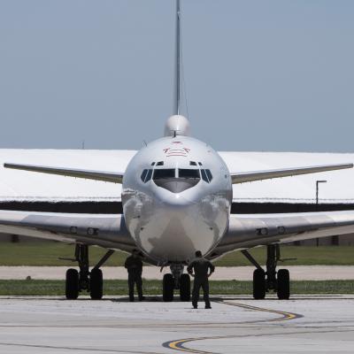 A U.S. Navy E-6B Mercury aircraft receives post-flight maintenance after landing at Offutt AFB, Nebraska.
