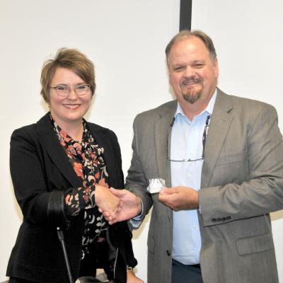 Deborah Moy receives FRCE coin  