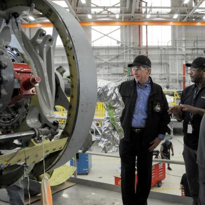 North Carolina Governor Roy Cooper views a V-22 nacelle with FRCE artisans