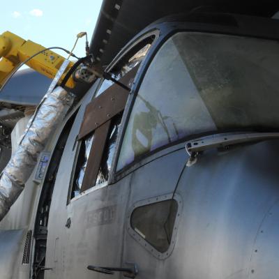 A mobile, autonomous robot deposits a cold spray coating on a V-22 aircraft