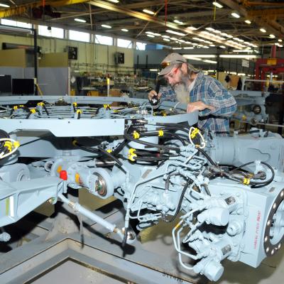 Aircraft mechanic inspects completed H-53 helicopter rotor head