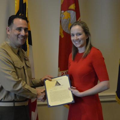 Susan Thompson, right, VX-23’s Flight Test Engineer of the Year for 2019, receives her letter of commendation as Naval Test Wing Atlantic’s Flight Test Engineer of the Year for 2019 from NTWL commander Col. Richard E. Marigliano.