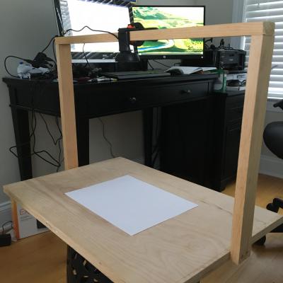 To help instruct remote students during the COVID-19 pandemic, U.S. Naval Test Pilot School instructors have rigged up ingenious alternatives to the traditional blackboard, like this overhead projection device in the home office of chief academic instructor John O'Connor.