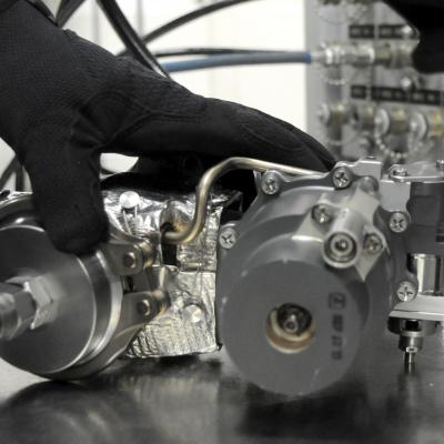 Man readies F-35 valve for testing