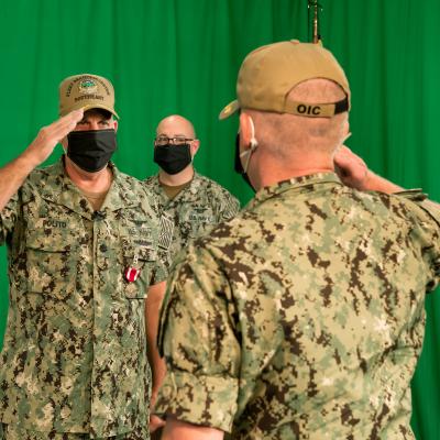 ACKSONVILLE, Fla. (May 21, 2020) Cmdr. Wilfred Judd III (right) accepts his new position as Officer in Charge (OIC), Fleet Readiness Center Southeast Det. Jacksonville.