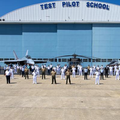 Rear Adm. John S. Lemmon, Commander of the Naval Air Warfare Center Aircraft Division and Assistant Commander for Research and Engineering at Naval Air Systems Command, and Col. Richard Marigliano, Commander of Naval Test Wing Atlantic, pose with the 34 graduates of U.S. Naval Test Pilot School Class 157 and the school’s command staff on Friday prior to the class’ graduation June 5, 2020 at NAS Patuxent River. (U.S. Navy photo)