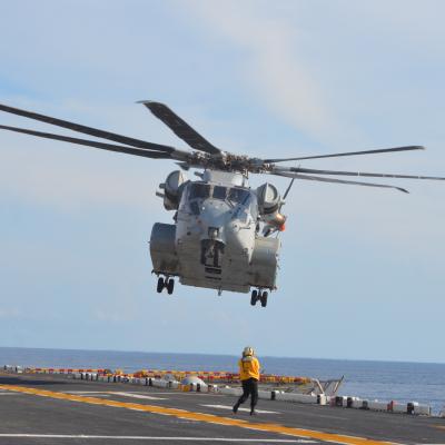 A CH-53K King Stallion belonging to Air Test and Evaluation Squadron (HX) 21 prepares to land aboard the USS Wasp (LHD 1) during sea trials to establish the helicopter's performance envelope for day and night launches and recoveries at a wide range of wind speeds. (U.S. Navy photo)