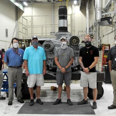 Group shot of team that facilitated helicopter repair