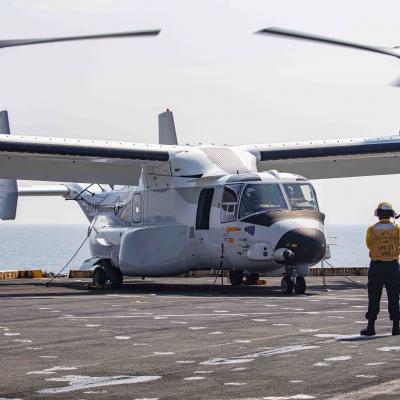 Aviation Boatswain’s Mate (Handling) 3rd Class Lorenzo Moreno, assigned to the transport dock ship USS New York (LPD 21), signals to a CMV-22B Osprey attached to the Blackjacks of Air Test and Evaluation Squadron (HX) 21 on the New York's flight deck on July 18, 2020. (U.S. Navy photo by Mass Communication Specialist 2nd Class Lyle Wilkie/Released)