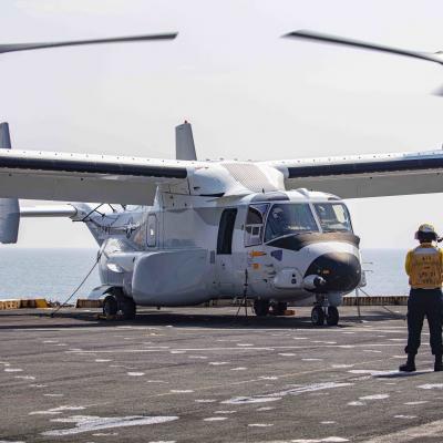 Aviation Boatswain’s Mate (Handling) 3rd Class Lorenzo Moreno, assigned to the transport dock ship USS New York (LPD 21), signals to a CMV-22B Osprey attached to the Blackjacks of Air Test and Evaluation Squadron (HX) 21 on the New York's flight deck on July 18, 2020. (U.S. Navy photo)