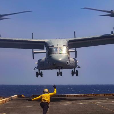 Boatswain’s Mate (Handling) 3rd Class Lorenzo Moreno, assigned to the amphibious transport dock ship USS New York (LPD 21), signals to an MV-22 Osprey attached to the Blackjacks of Air Test and Evaluation Squadron (HX) 21 on July 20, 2020. (U.S. Navy photo)