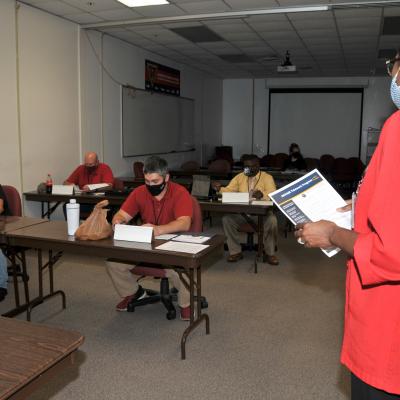 Newly hired apprentices receive training.