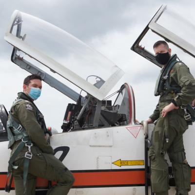 NASA research pilot and U.S. Naval Test Pilot School (USNTPS) instructor Cmdr. Adam Klein, right, prepares for a T-38C training flight with USNTPS student Lt. Spencer Smith. Klein and fellow instructor Dick Clark oversaw the training of USNTPS students in NASA's T-38N simulator in Houston, Texas, after the COVID-19 pandemic prevented students from being able to conduct their pre-arrival training at Randolph Air Force Base. (U.S. Navy photo by Paul Lagasse)