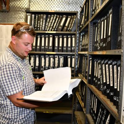 Data management technician edits technical manual.