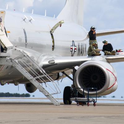 Sailors assigned to Patrol Squadron 1 conduct engine maintenance on a P-8A Poseidon. 