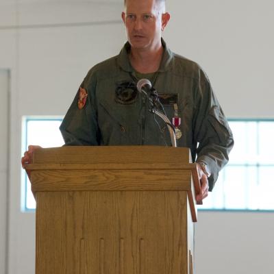 Lt. Col. John Ennis delivers remarks during the change of command ceremony for Air Test and Evaluation Squadron (HX) 21 on Oct. 9, 2020. During the ceremony, Ennis was relieved by CDR Daniel Short, the squadron’s chief test pilot. (U.S. Navy photo by Paul Lagasse)
