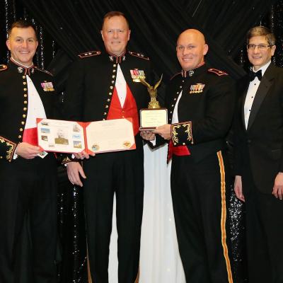 Maj. Nathaniel Thayer, second from right, AV-8B Joint Systems Support Activity military deputy, is honored as the Marine Corps Aviation Administration John Glenn Squadron Test Pilot of the Year by
