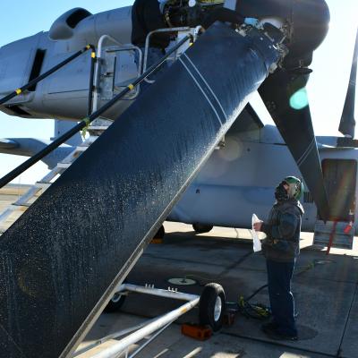 Workers inspect V-22 Osprey