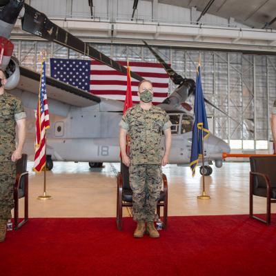 Col. Matthew Kelly, Maj. Gen. Greg Masiello, and Col. Brian Taylor stand at attention during the V-22 Joint Program Office (PMA-275) change of command ceremony Apr. 29 at Naval Air Station Patuxent River. The ceremony commemorated the transfer of duty from Col. Kelly to Col. Taylor.  
