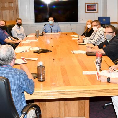 Group of FRCE leaders around table