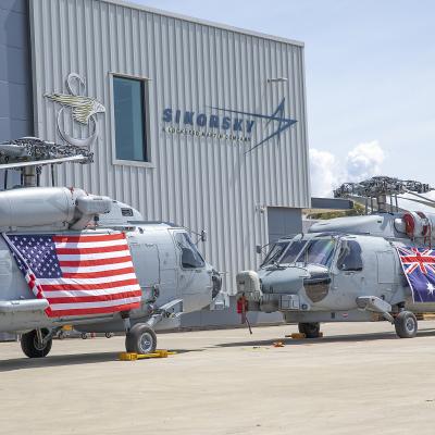 Two U.S. Navy and Royal Australian Navy MH-60R in front of Sikorsky Australia building in Norwa, Australia