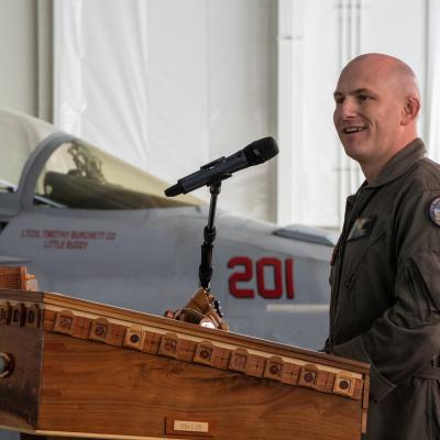  Lt. Col. Timothy “Little Buddy” Burchett, U.S. Marine Corps, delivers remarks after assuming command of VX-31 during a change of command ceremony at Naval Air Weapons Station China Lake on March 6, 2025. Burchett previously served as the squadron’s chief test pilot. (U.S. Navy photo by Ryan Smith) 