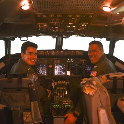 Two pilots in a cockpit trainer