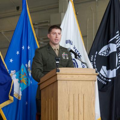 Marine Corps Maj. Kyle Kanode speaks during a graduation ceremony.
