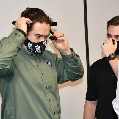Engineer tries on augmented reality headset