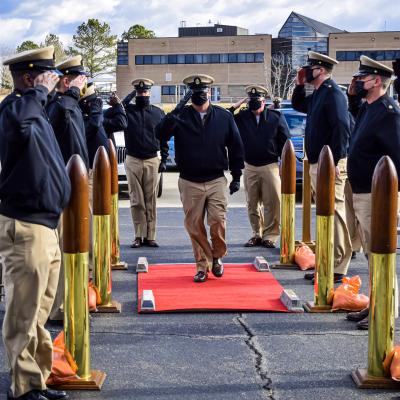 Chief Aviation Electronics Technician Stephen Paustian renders a hand salute following his advancement during a chief petty officer (CPO) pinning ceremony hosted by the U.S. Naval Test Pilot School at Naval Air Station Patuxent River on Jan. 29, 2021.