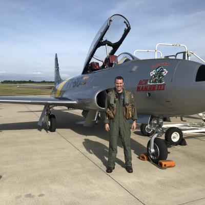 Lt. Mahmood Alaverdi, the E-2D Advanced Hawkeye project officer at Air Test and Evaluation Squadron (VX) 20, poses with “Ace Maker III,” a restored Canadair CT-133 jet trainer from the 1950s, following a qualitative evaluation flight at the U.S. Naval Test Pilot School. Alaverdi is the Airborne Command & Control and Logistics Wing’s 2020 Hawkeye Pilot of the Year (Ashore).