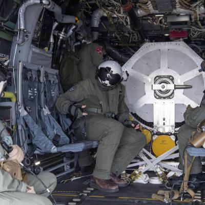 Sailors with Fleet Logistics Multi-Mission Squadron (VRM) 30 prepare for takeoff inside of a CMV-22B Osprey carrying an F-35C engine module on the flight deck of Nimitz-class nuclear aircraft carrier USS Carl Vinson (CVN 70)
