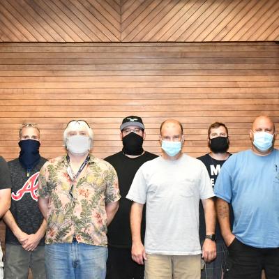 FRCE employees post for a group photo following an award ceremony