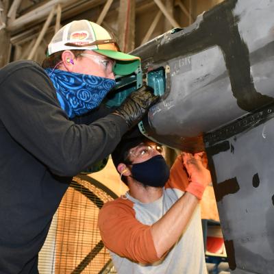 Artisans replace panels on Harrier